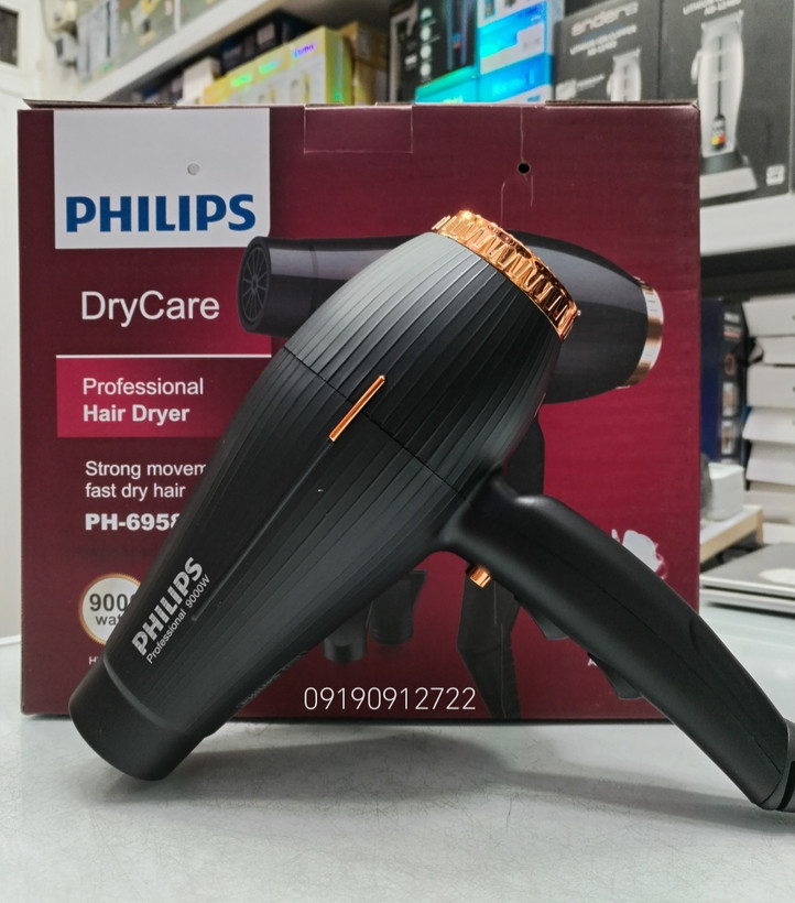 سشوار فیلیپس مدل PH-6958 موتور AC 9000وات دارای دکمه خنک کننده وسه حالت دما به صورت خنک، متوسط وگرم دارای دو سری مترکز کننده کیفیت عالی قدرت بالا بدنه مقاوم